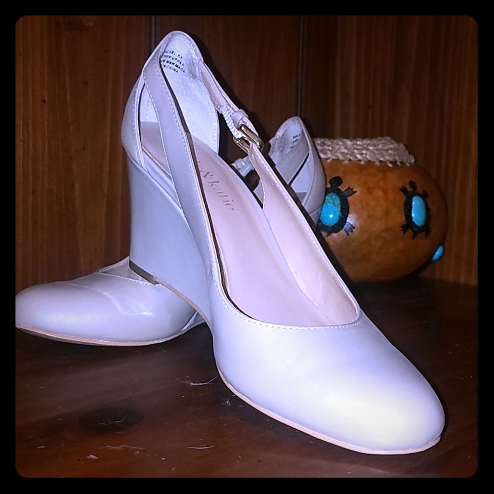 Nude colored wedge pumps